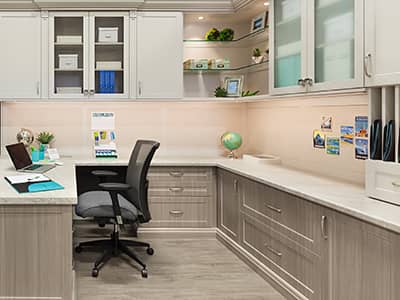 modern home office with custom cabinetry storage